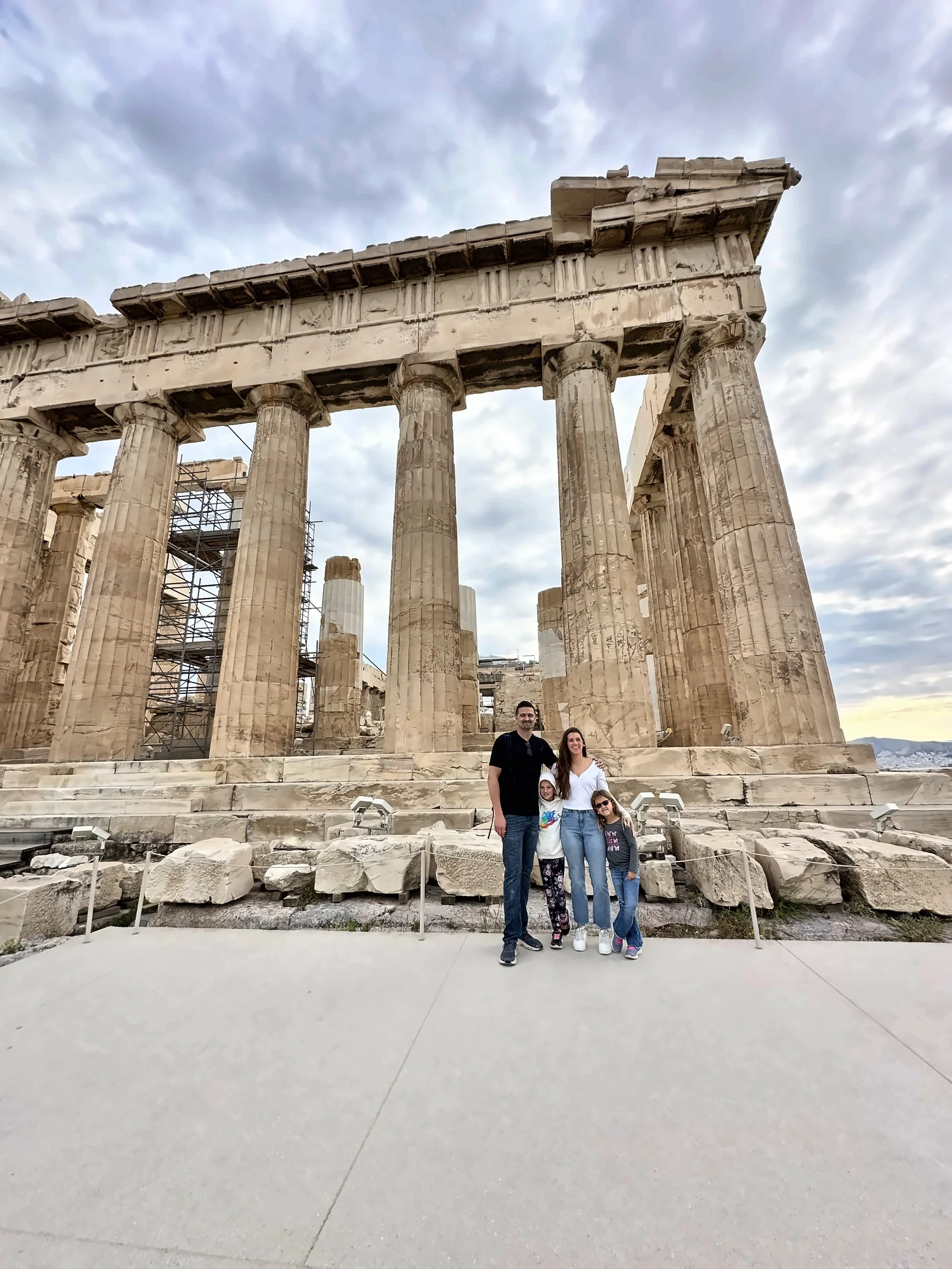 The Fredette family standing in front of the Parthenon on the Acropolis in Athens, Greece